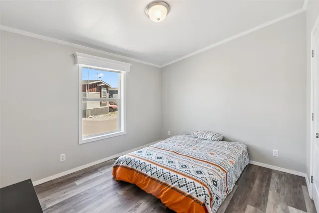 a bedroom with bed and a window