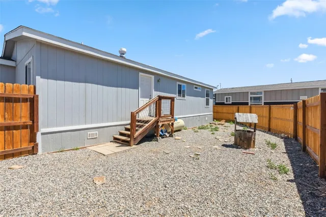 a view of a house with a snow in the background