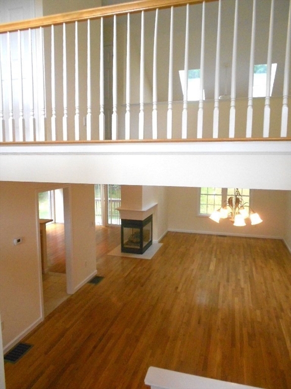 141 Lordvale Boulevard, Unit 141 Grafton, MA 01536 - Photo 14 of 23 a view of a living room and wooden floor