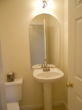 141 Lordvale Boulevard, Unit 141 Grafton, MA 01536 - Photo 15 of 23 a bathroom with a sink mirror and toilet