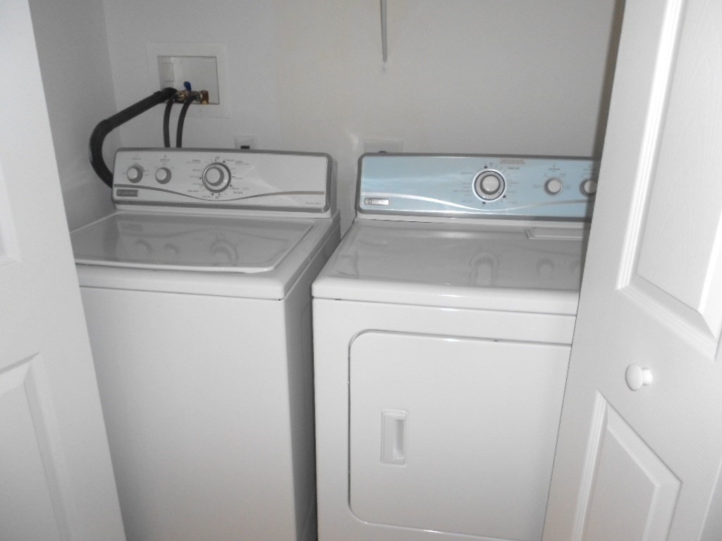 141 Lordvale Boulevard, Unit 141 Grafton, MA 01536 - Photo 20 of 23 a utility room with dryer and washer