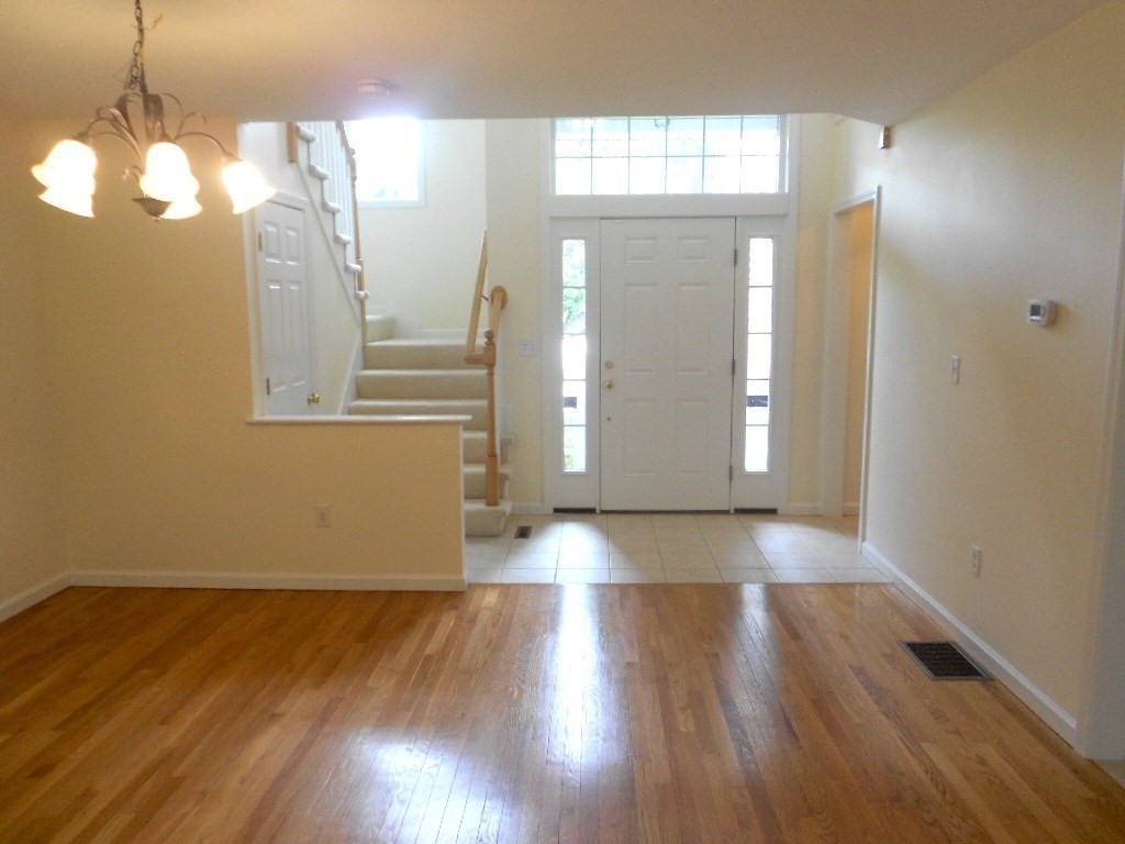 141 Lordvale Boulevard, Unit 141 Grafton, MA 01536 - Photo 5 of 23 a view of a room with wooden floor