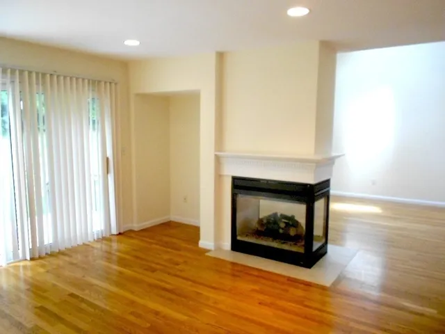 a room with a fireplace and a fireplace