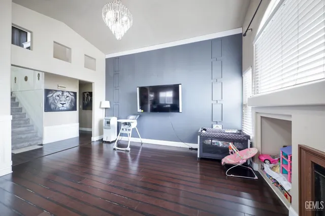 a spacious bedroom with a bed and a large window