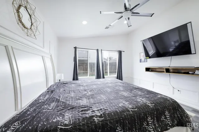 a bathroom with a granite countertop tub sink a shower and a mirror