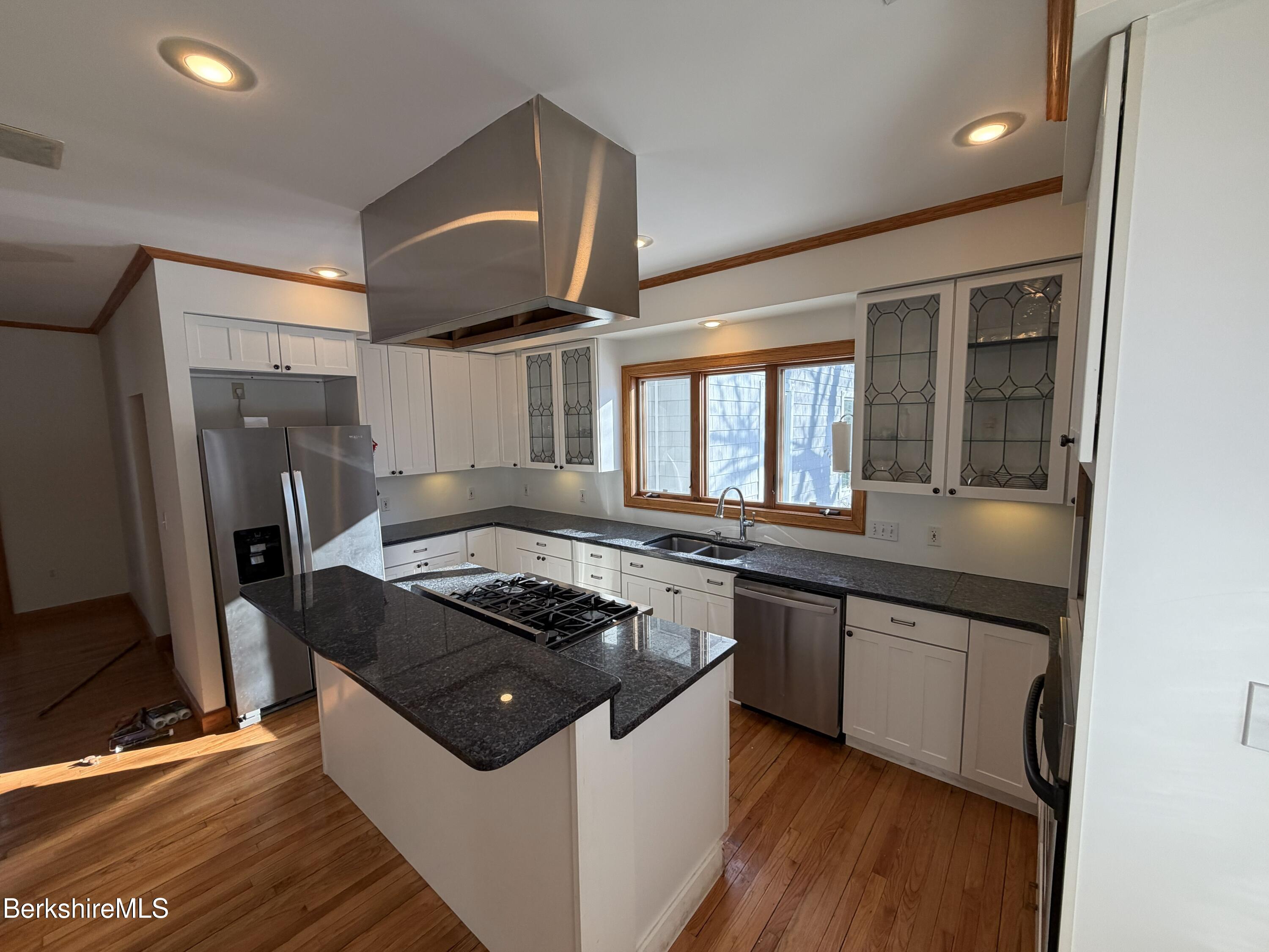 7 Poirot Road Florida, MA 01247 - Photo 12 of 57 a kitchen with stainless steel appliances granite countertop a stove and a sink
