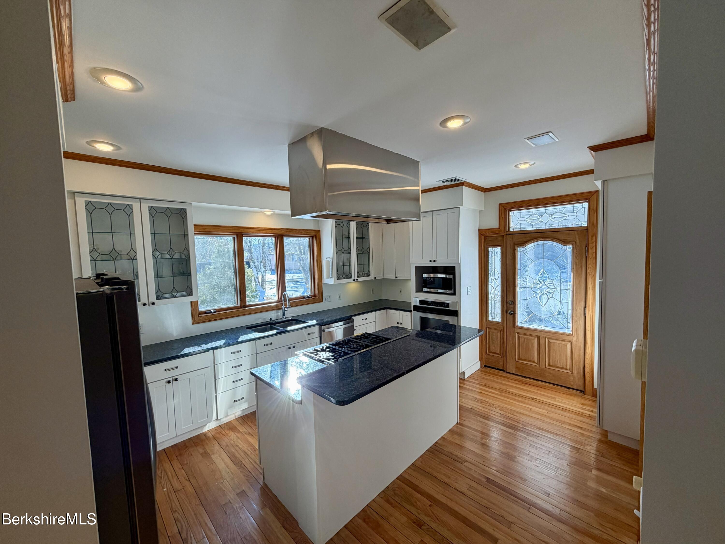 7 Poirot Road Florida, MA 01247 - Photo 13 of 57 a large kitchen with granite countertop a large counter top appliances and cabinets
