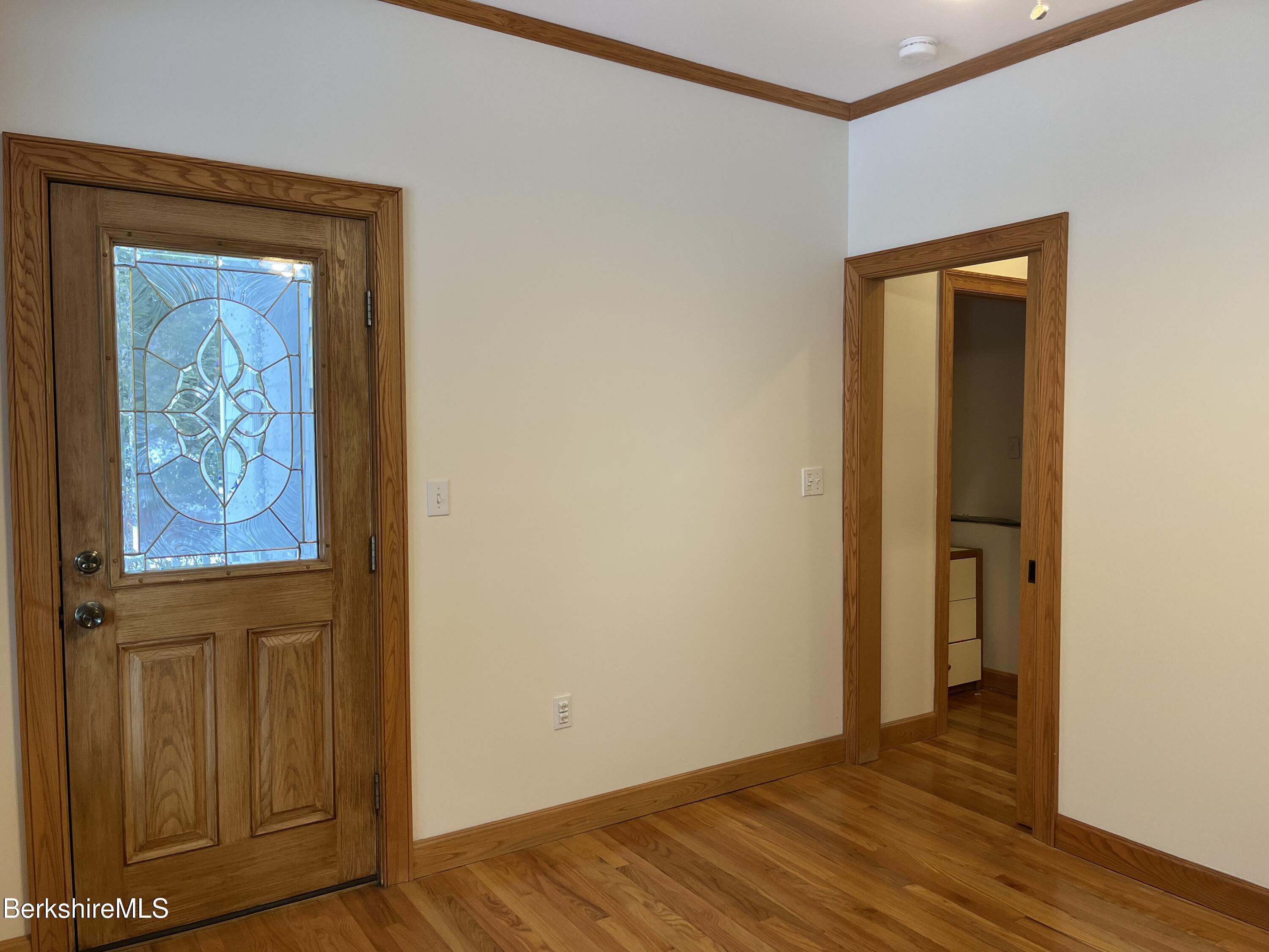 7 Poirot Road Florida, MA 01247 - Photo 37 of 57 an empty room with wooden floor and closet