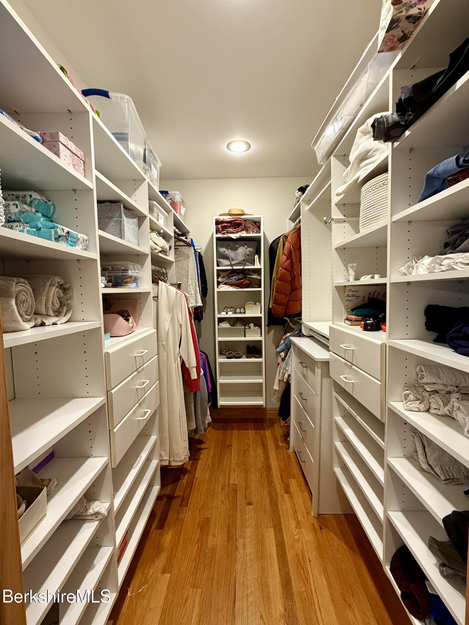 7 Poirot Road Florida, MA 01247 - Photo 42 of 57 a view of walk in closet with clothes and shoes