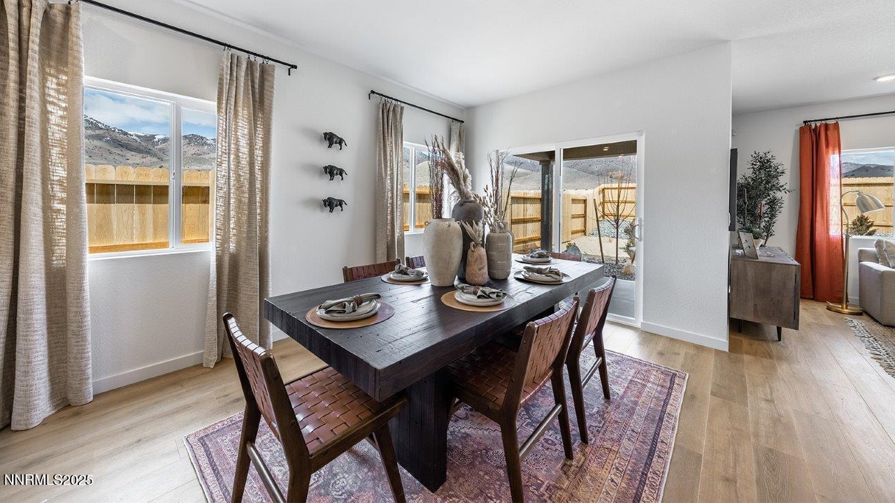 612 Union Road, Unit LOT #64 Dayton, NV 89403 - Photo 12 of 25 a view of a dining room with furniture and wooden floor