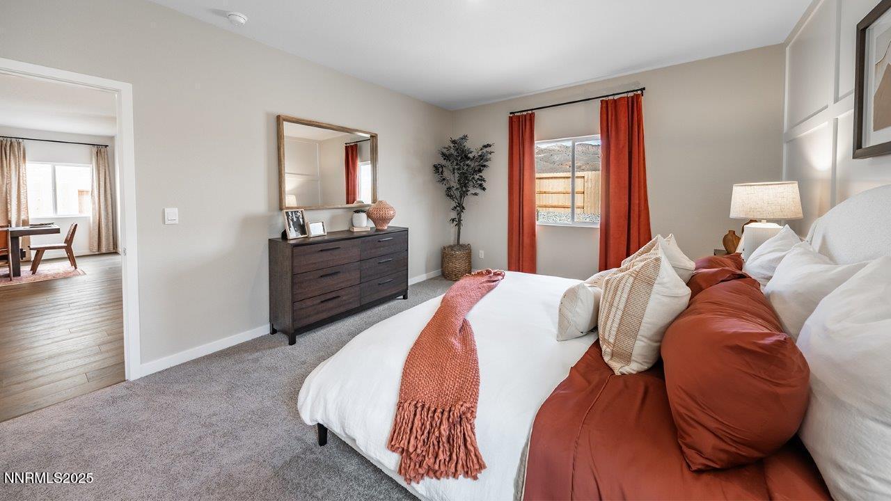 612 Union Road, Unit LOT #64 Dayton, NV 89403 - Photo 18 of 25 a bedroom with a bed and wooden floor