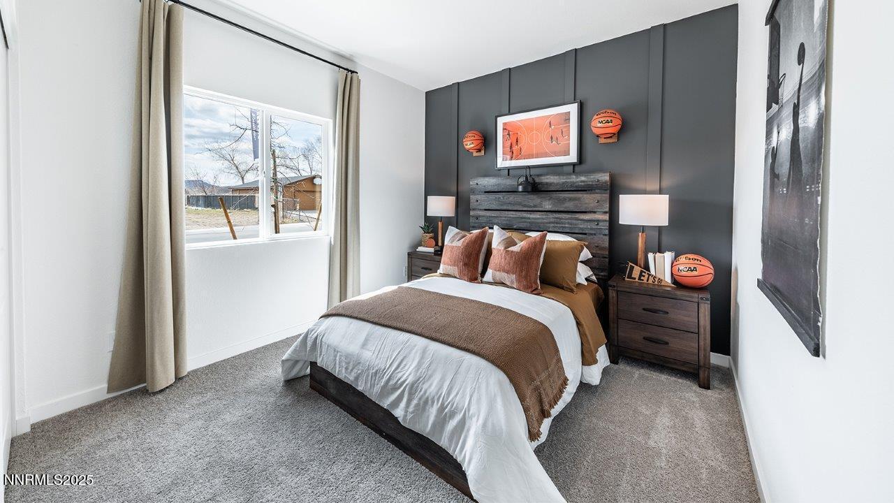 612 Union Road, Unit LOT #64 Dayton, NV 89403 - Photo 24 of 25 a bedroom with a bed and a flat tv screen