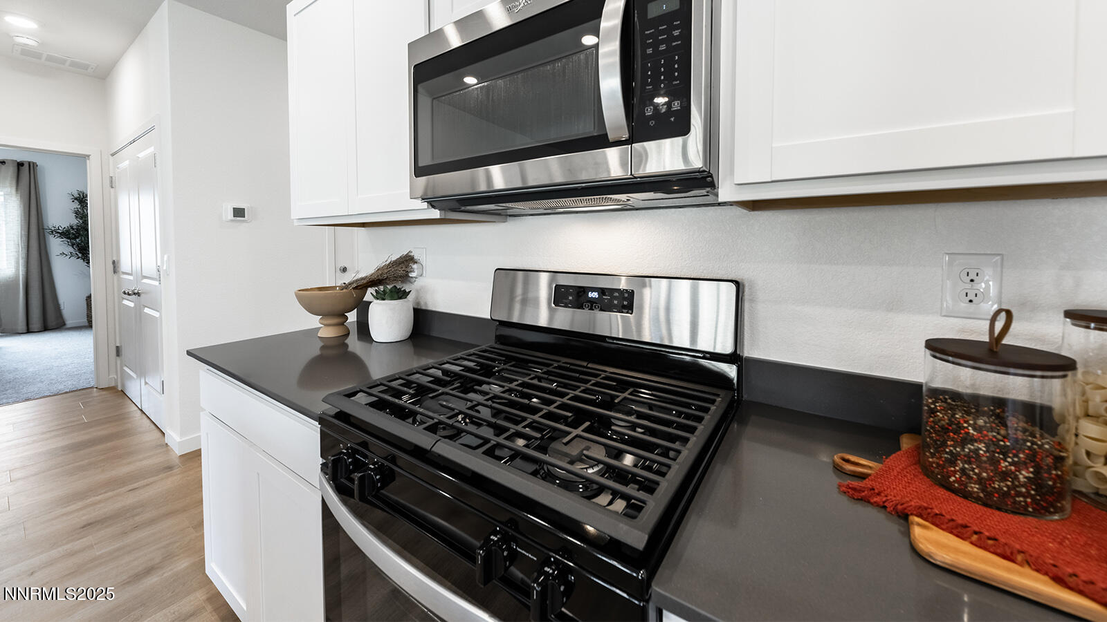612 Union Road, Unit LOT #64 Dayton, NV 89403 - Photo 7 of 25 a kitchen with stainless steel appliances granite countertop a stove a microwave and cabinets