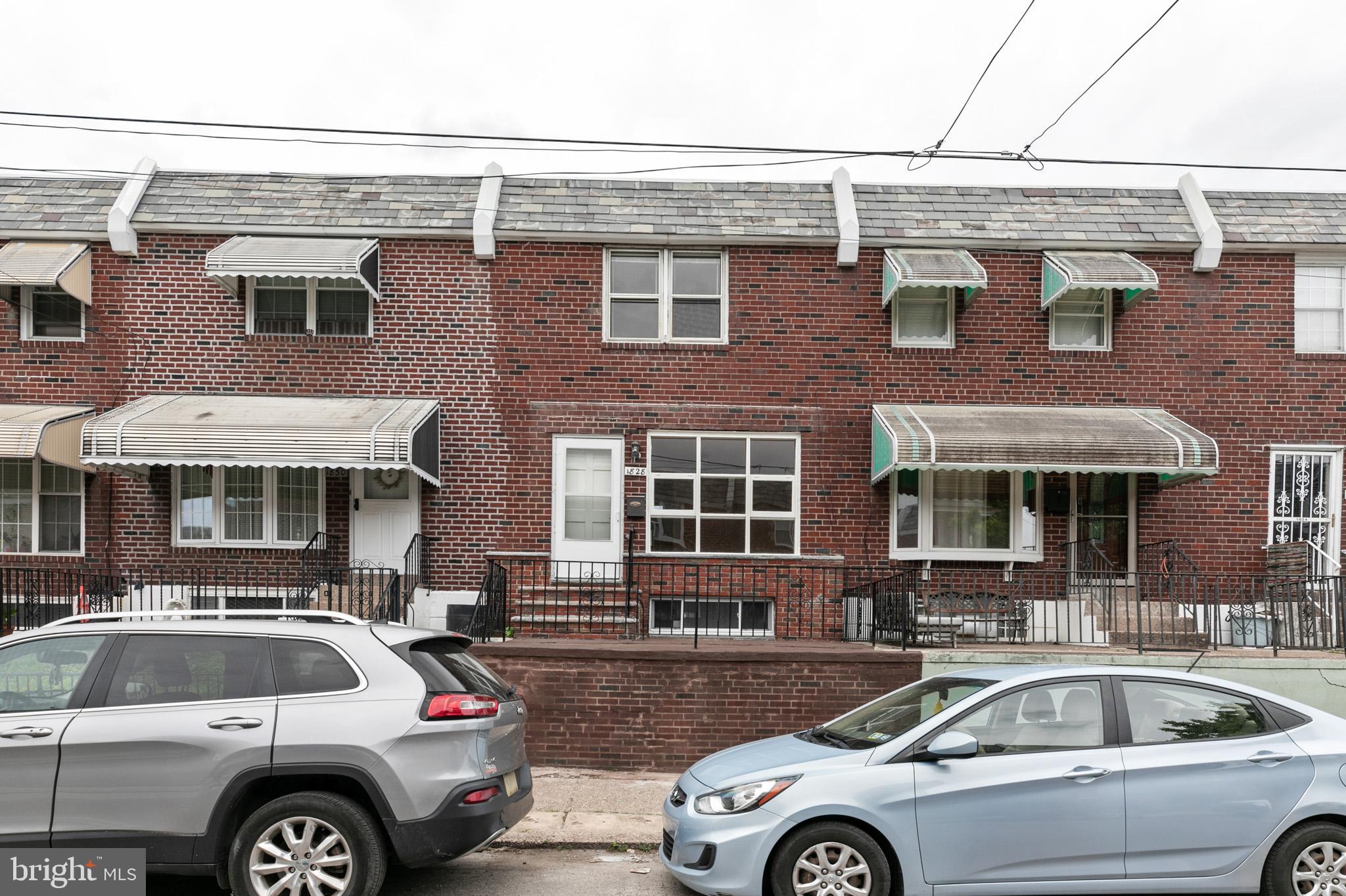 a front view of a house with parking space