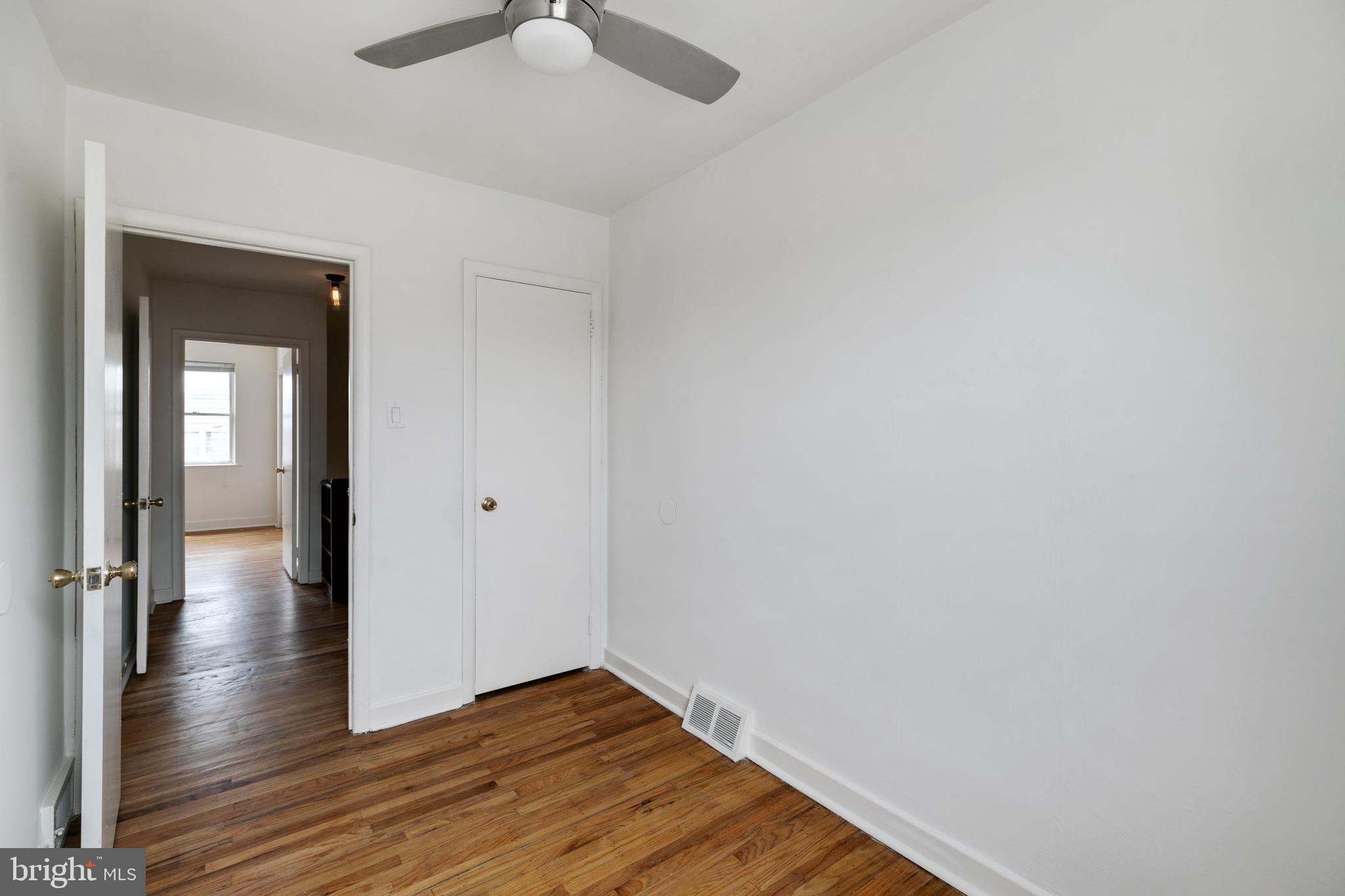 1828 South 29th Street Philadelphia, PA 19145 - Photo 23 of 32 a view of a hallway with wooden floor