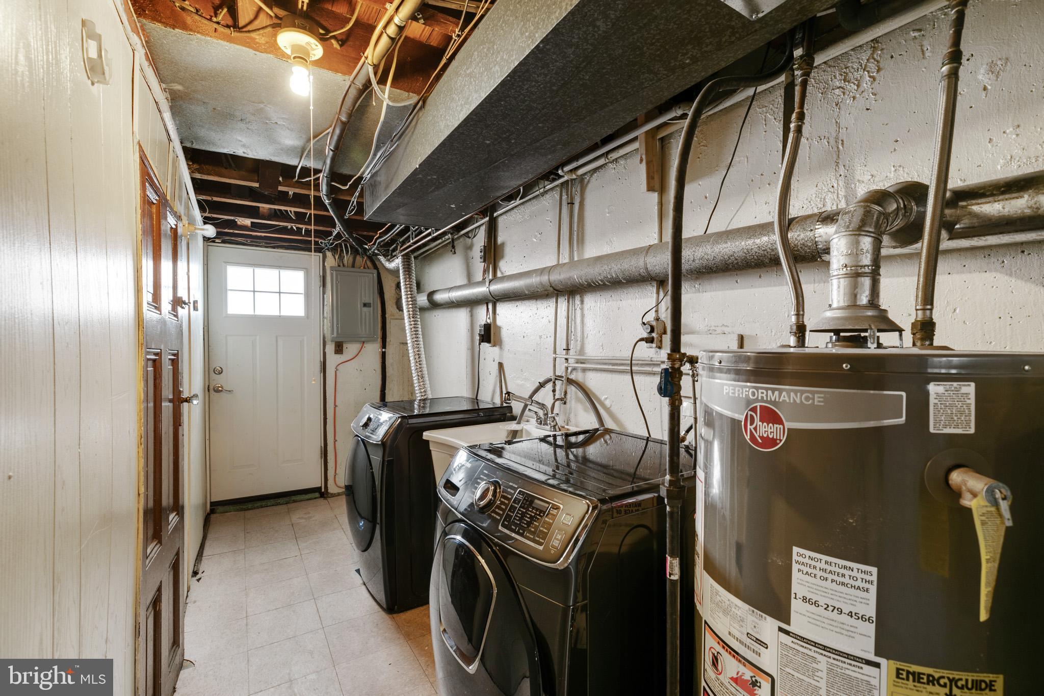 1828 South 29th Street Philadelphia, PA 19145 - Photo 26 of 32 a view of storage and utility room with washer and dryer