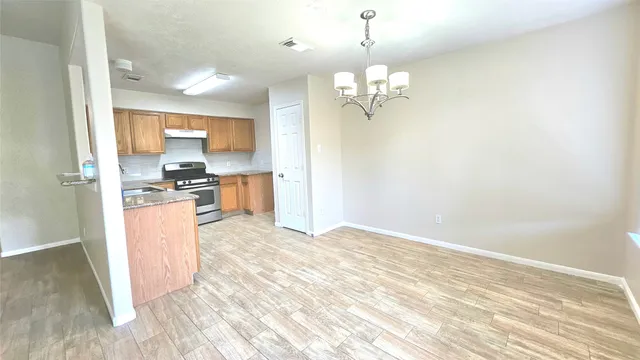 a view of a kitchen with a sink