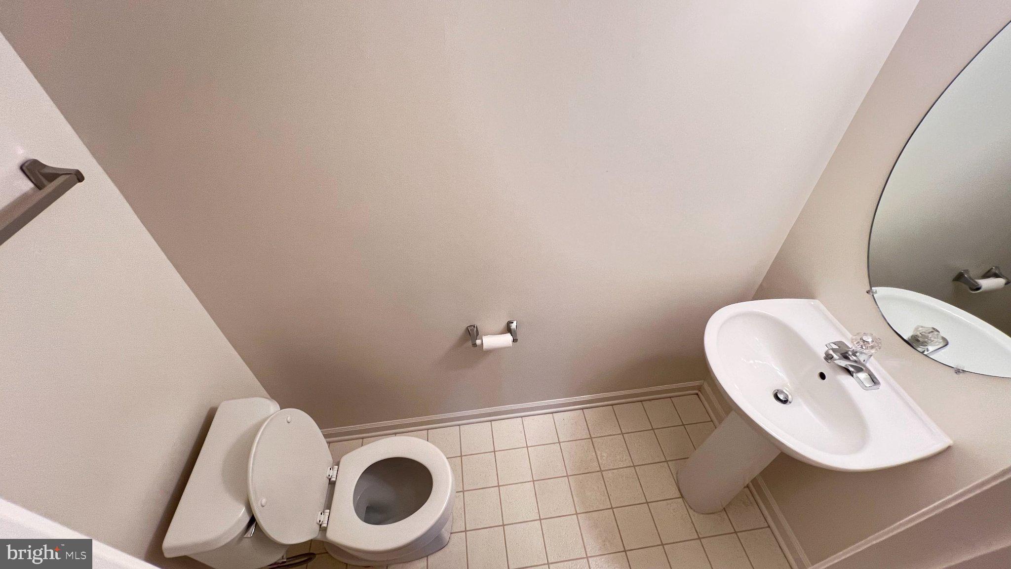 4100 Flower Fairfax, VA 22030 - Photo 33 of 47 a bathroom with a toilet and a mirror