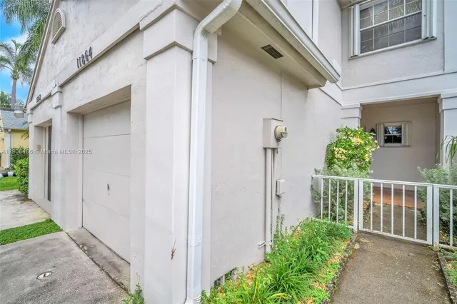 a view of a house with a small yard