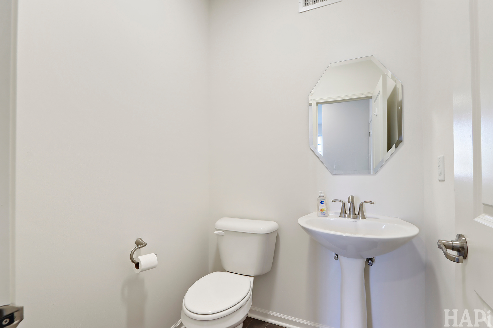 8426 Stillwater Road Wonder Lake, IL 60097 - Photo 16 of 32 a bathroom with a toilet sink and mirror