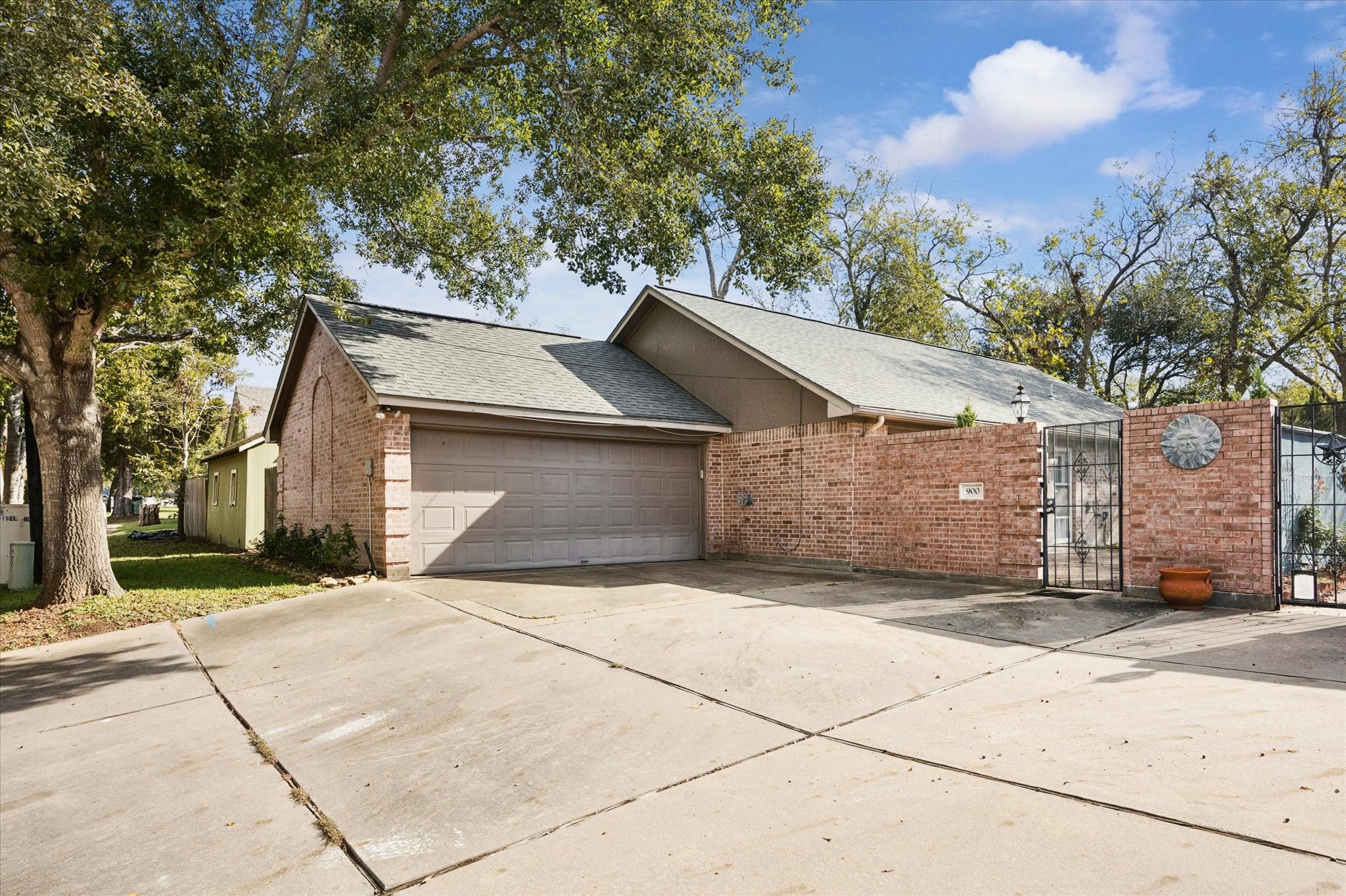 900 Eagle Lake Road Sealy, TX 77474 - Photo 1 of 15 a front view of a house with a yard and garage
