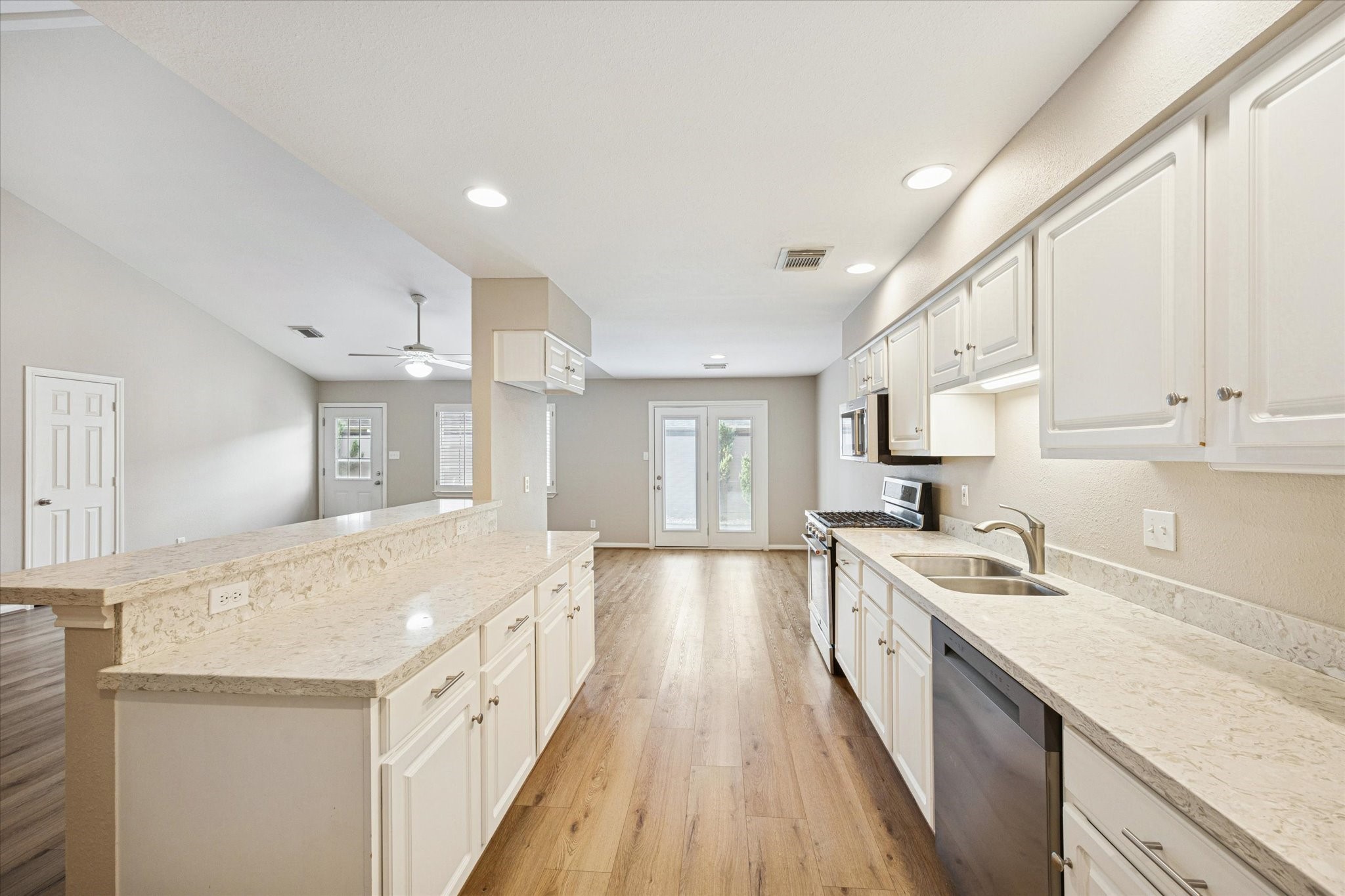 900 Eagle Lake Road Sealy, TX 77474 - Photo 10 of 15 a large kitchen with stainless steel appliances granite countertop a sink and dishwasher with a stove top oven
