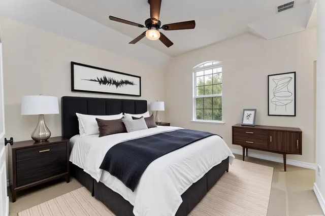 a bedroom with a bed and dresser