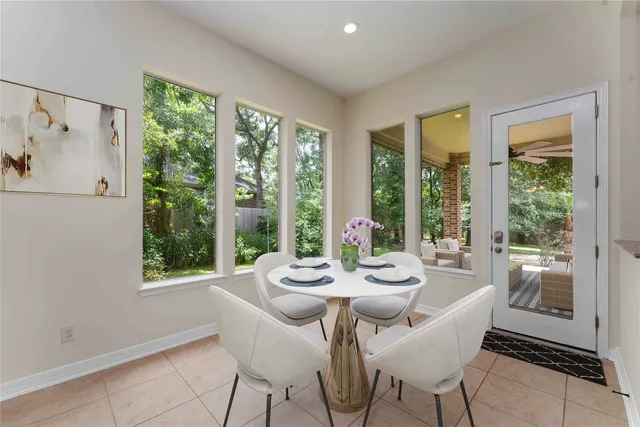 a view of a dining room with furniture window and outside view