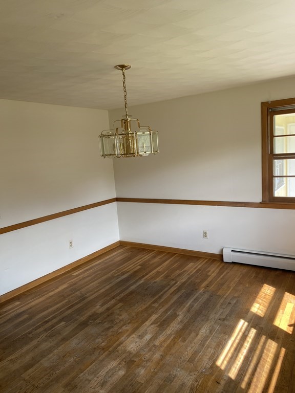29 Justice Drive Amherst, MA 01002 - Photo 11 of 20 a view of a room with wooden floor and a window