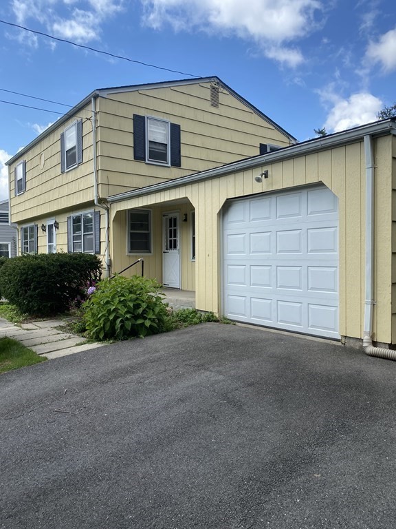 29 Justice Drive Amherst, MA 01002 - Photo 2 of 20 a front view of a house with a yard and garage