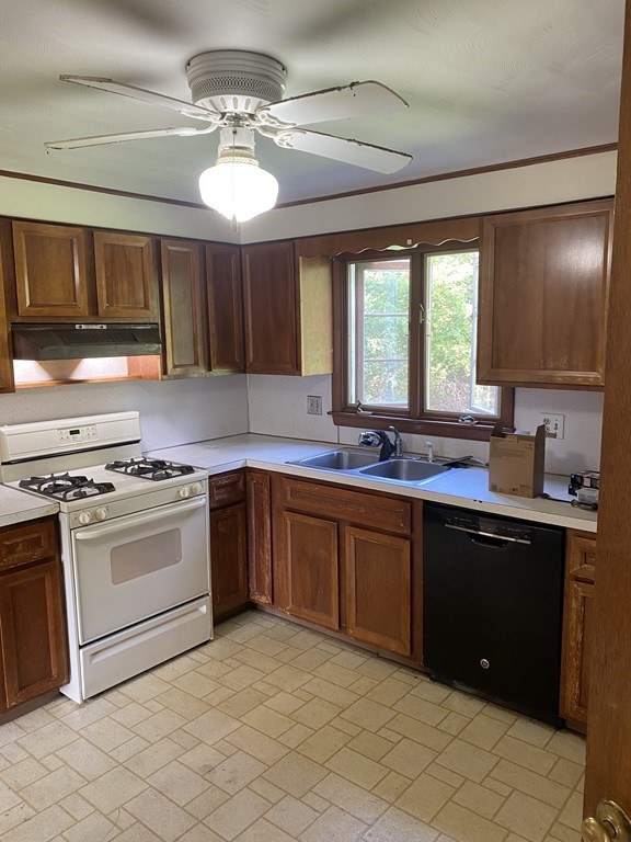29 Justice Drive Amherst, MA 01002 - Photo 4 of 20 a kitchen with stainless steel appliances granite countertop a sink counter space cabinets and a large window