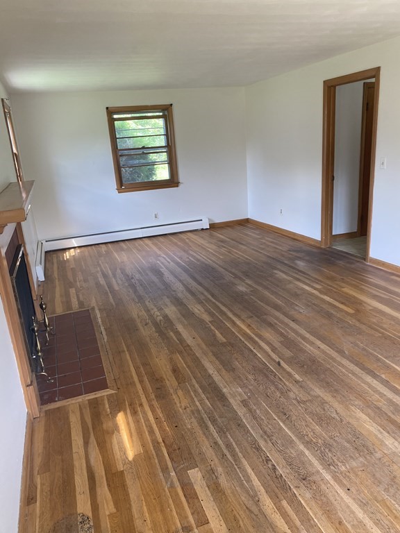 29 Justice Drive Amherst, MA 01002 - Photo 6 of 20 a view of an empty room with wooden floor