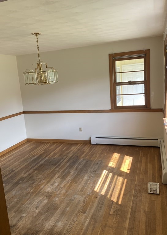 29 Justice Drive Amherst, MA 01002 - Photo 10 of 20 a view of a room with wooden floor and white walls