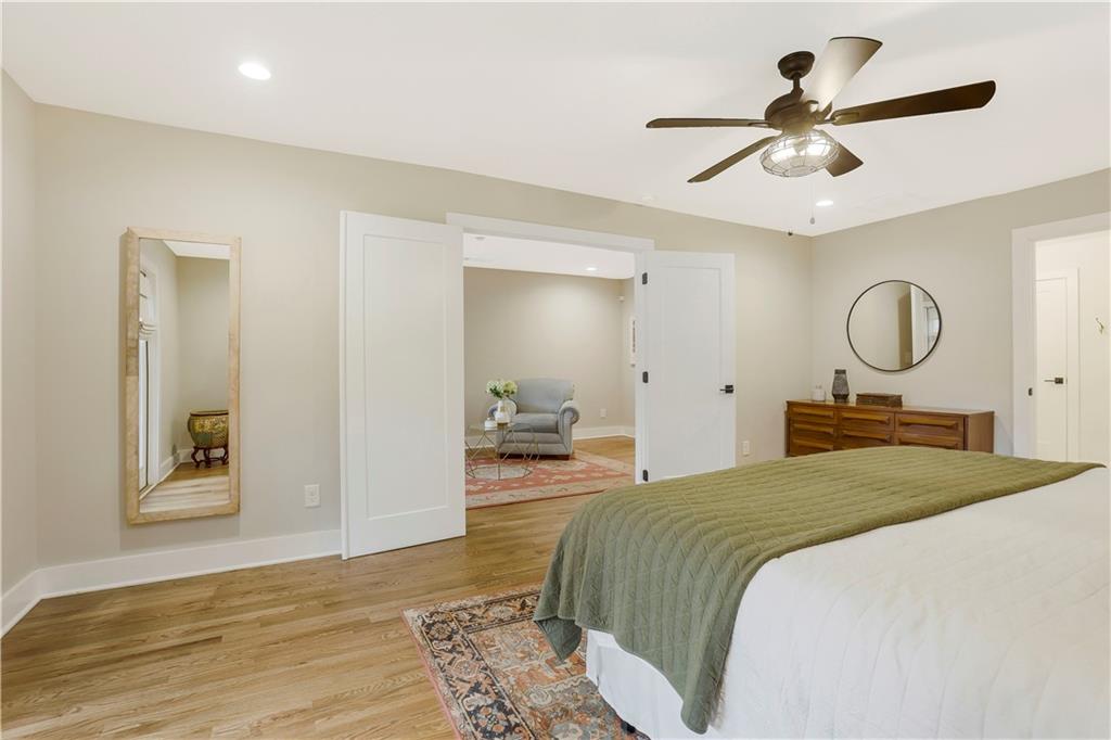 1344 Midlawn Drive Decatur, GA 30032 - Photo 12 of 43 a bedroom with a large bed and a chandelier