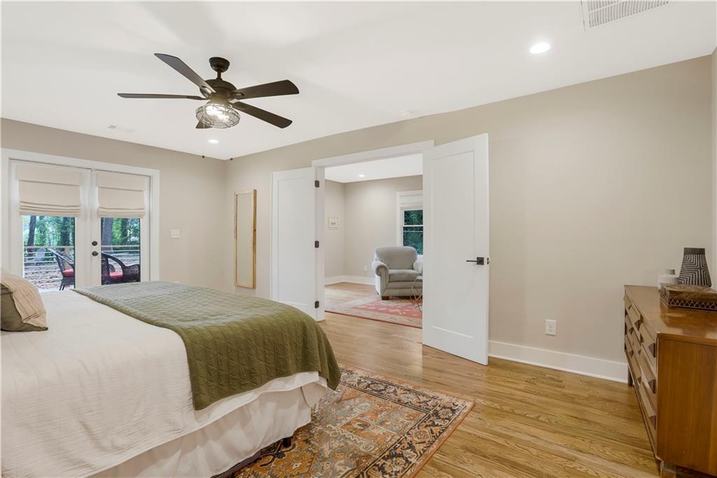 1344 Midlawn Drive Decatur, GA 30032 - Photo 13 of 43 a bedroom with a bed and wooden floor