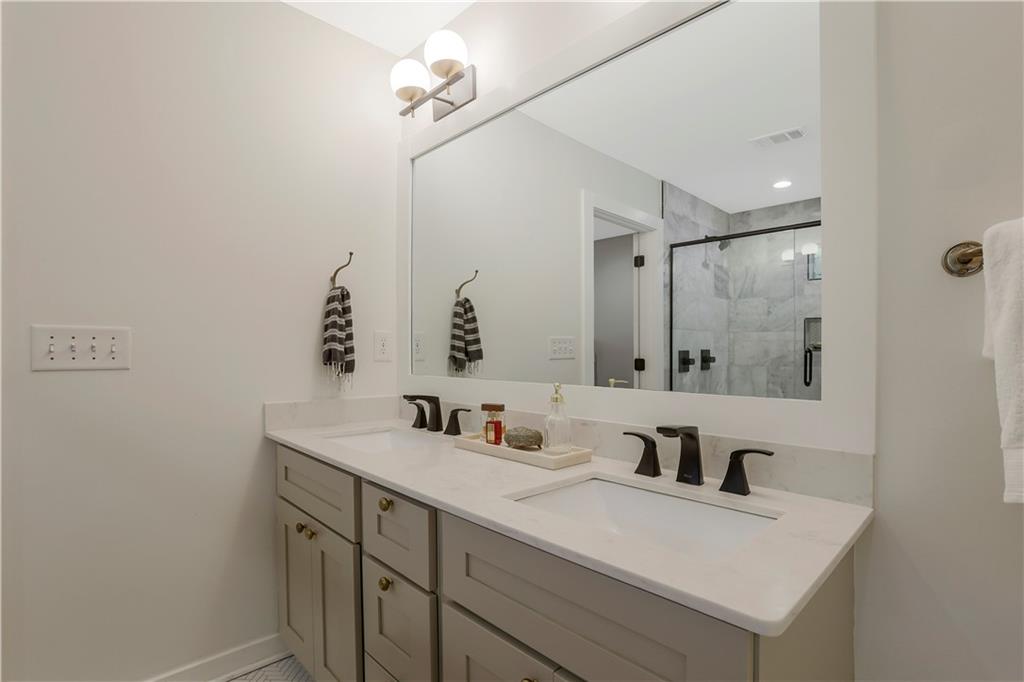 1344 Midlawn Drive Decatur, GA 30032 - Photo 15 of 43 a bathroom with a sink vanity granite and a mirror