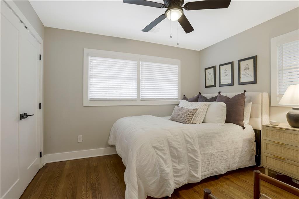 1344 Midlawn Drive Decatur, GA 30032 - Photo 18 of 43 a bedroom with a bed and wooden floor