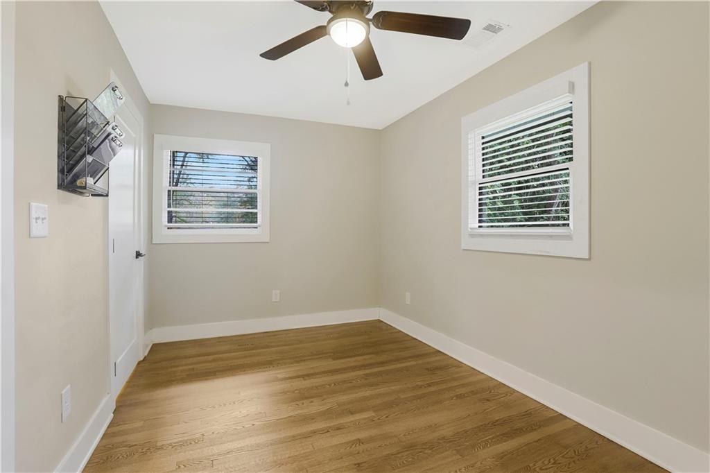 1344 Midlawn Drive Decatur, GA 30032 - Photo 20 of 43 a view of empty room with wooden floor and fan