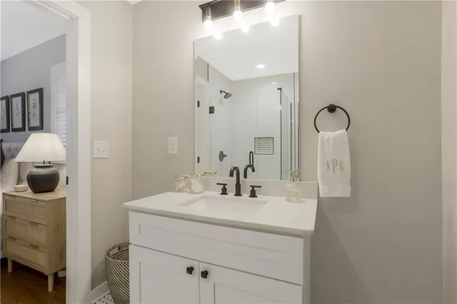 a bathroom with a sink and a mirror