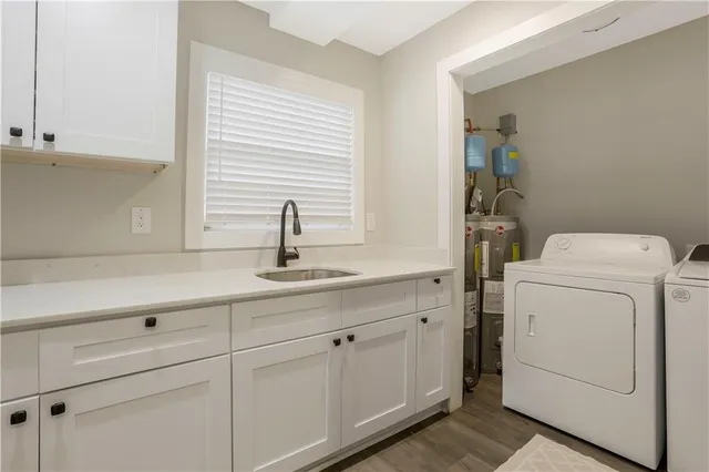 a utility room with dryer and washer