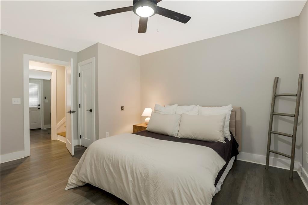 1344 Midlawn Drive Decatur, GA 30032 - Photo 28 of 43 a bedroom with a bed and wooden floor