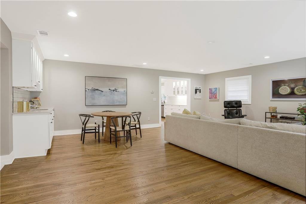 1344 Midlawn Drive Decatur, GA 30032 - Photo 3 of 43 a living room with furniture a dining table and a stove top oven