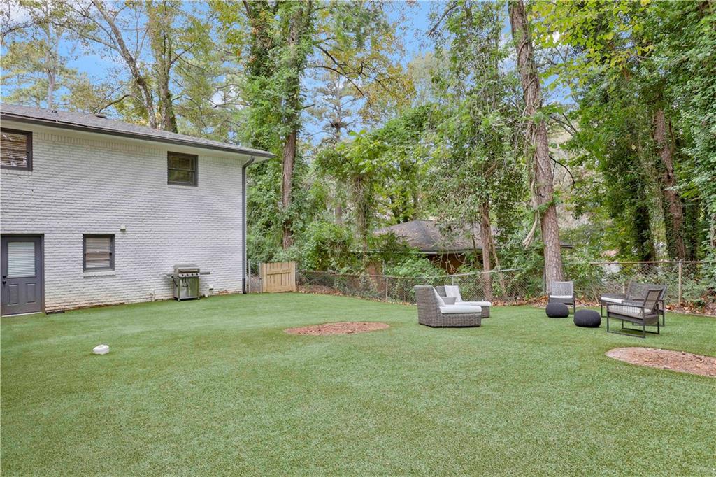 1344 Midlawn Drive Decatur, GA 30032 - Photo 34 of 43 a front view of a house with garden