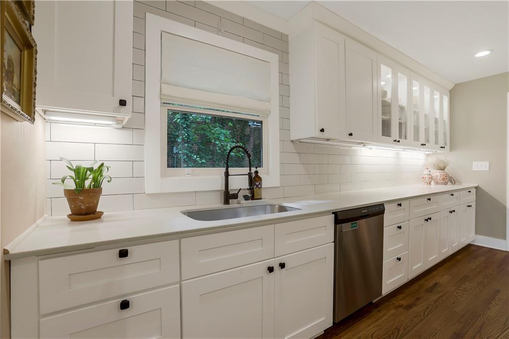 1344 Midlawn Drive Decatur, GA 30032 - Photo 9 of 43 a kitchen with white cabinets and sink