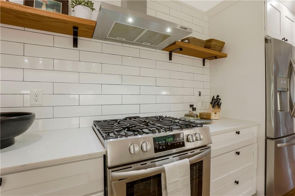 1344 Midlawn Drive Decatur, GA 30032 - Photo 10 of 43 a kitchen with a stove and a refrigerator