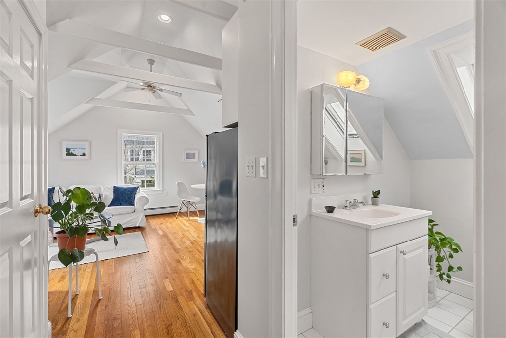 3 Circle Street, Unit 3 Marblehead, MA 01945 - Photo 13 of 23 a view of a hallway to a livingroom and a dining room with furniture wooden floor