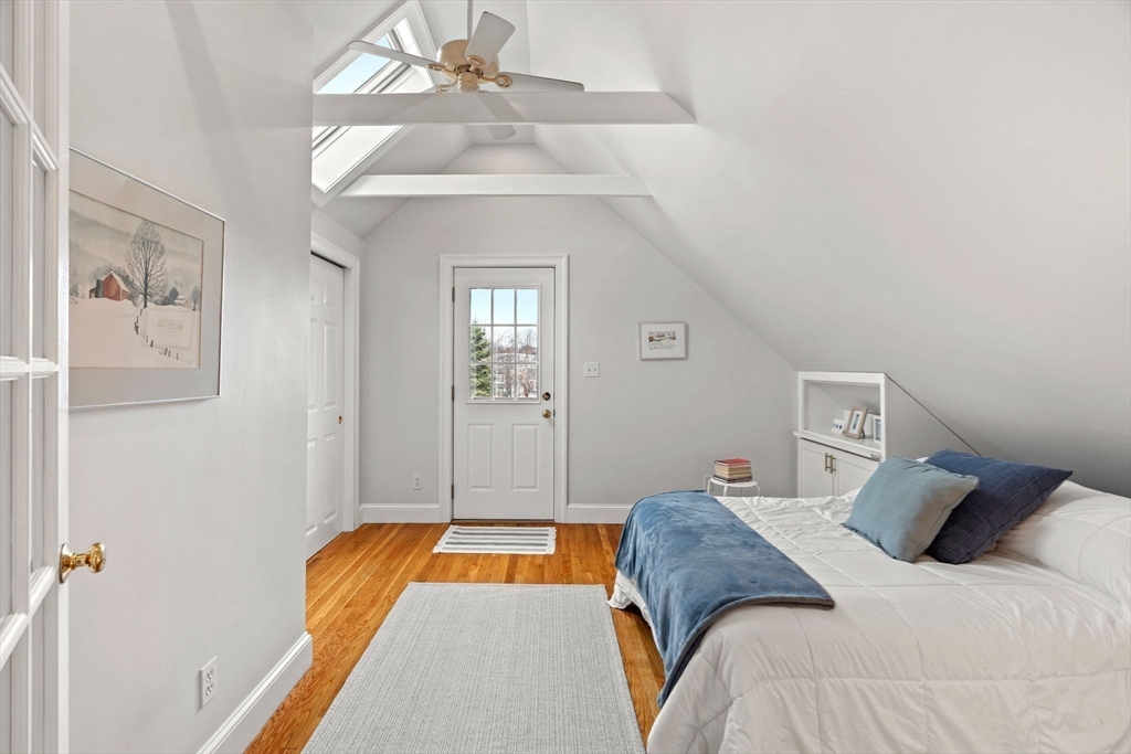 3 Circle Street, Unit 3 Marblehead, MA 01945 - Photo 15 of 23 a bedroom with a bed and a chandelier
