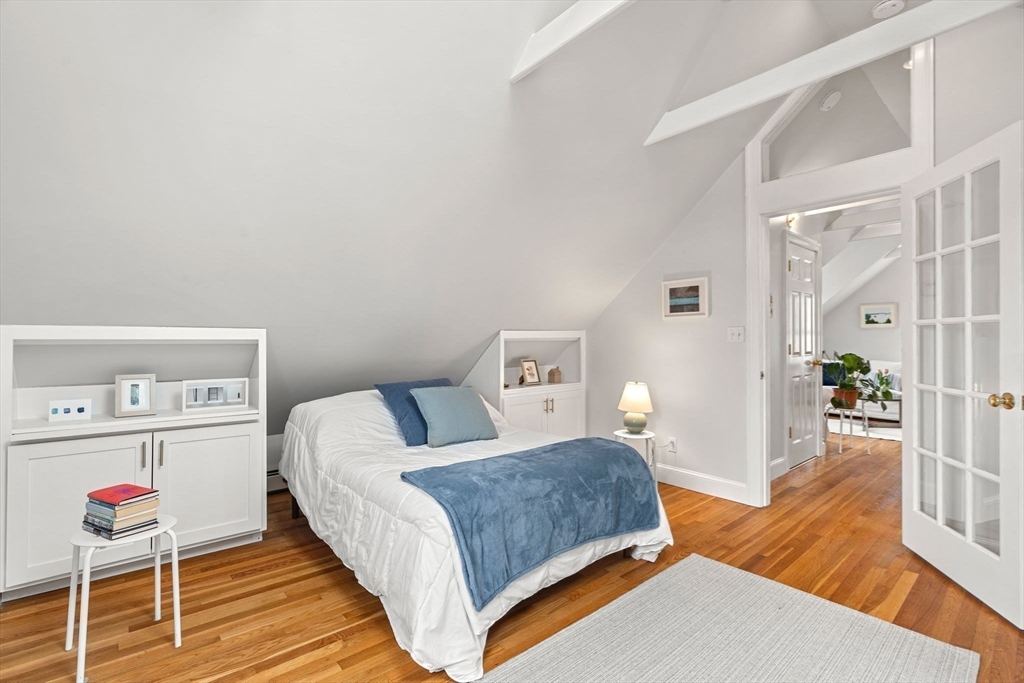 3 Circle Street, Unit 3 Marblehead, MA 01945 - Photo 17 of 23 a bedroom with a bed and wooden floor
