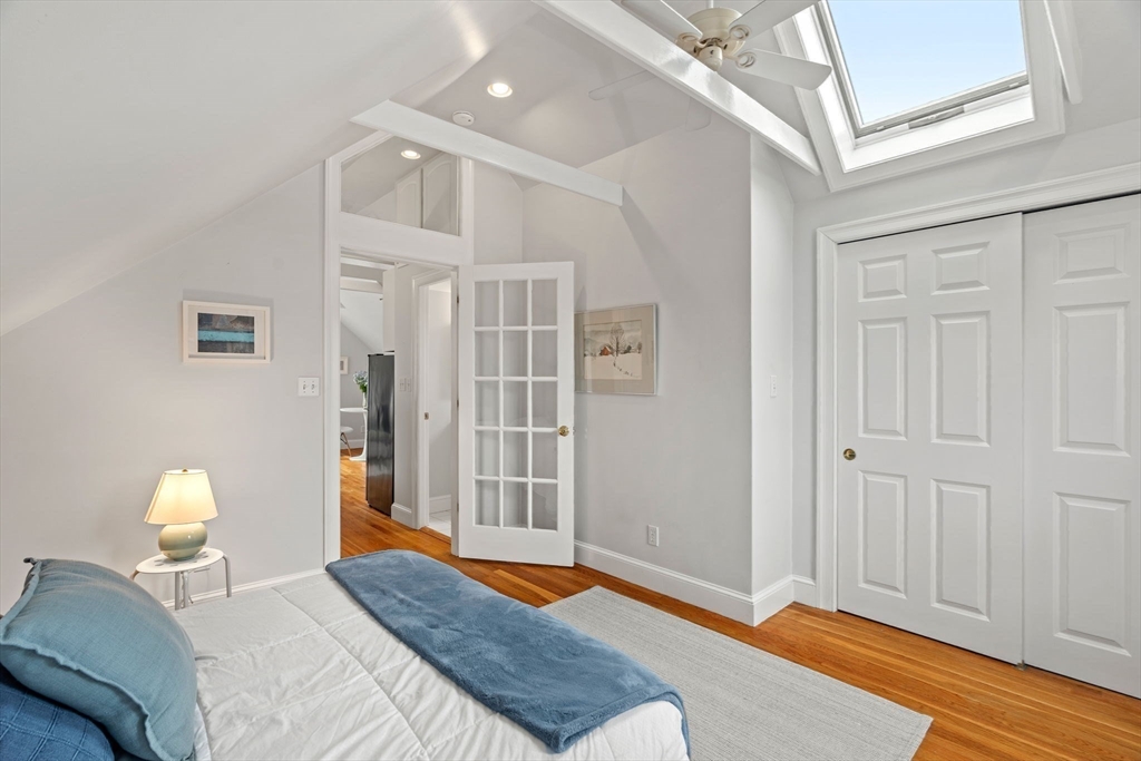 3 Circle Street, Unit 3 Marblehead, MA 01945 - Photo 18 of 23 a bedroom with a bed and wooden floor