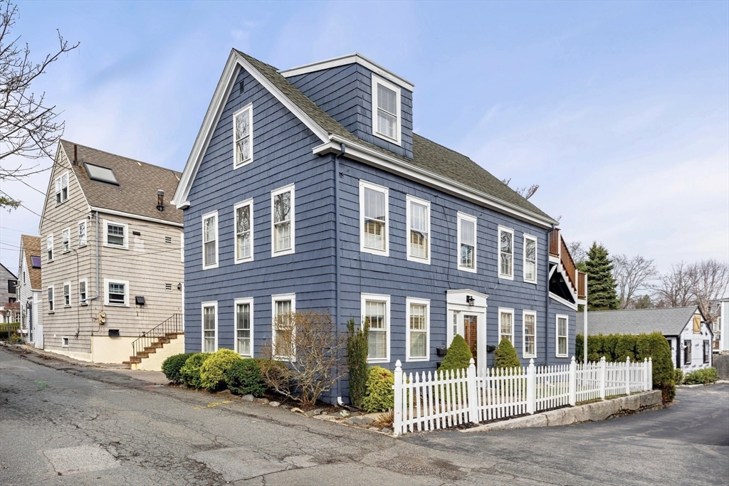 3 Circle Street, Unit 3 Marblehead, MA 01945 - Photo 2 of 23 a front view of a house with a garden